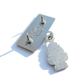 Photo of the back of the pin with a Pinny Arcade backstamp.