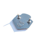 Photo of the back of the pin with a Pinny Arcade backstamp.