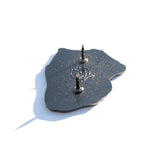 Photo of the back of the pin with a Pinny Arcade backstamp.