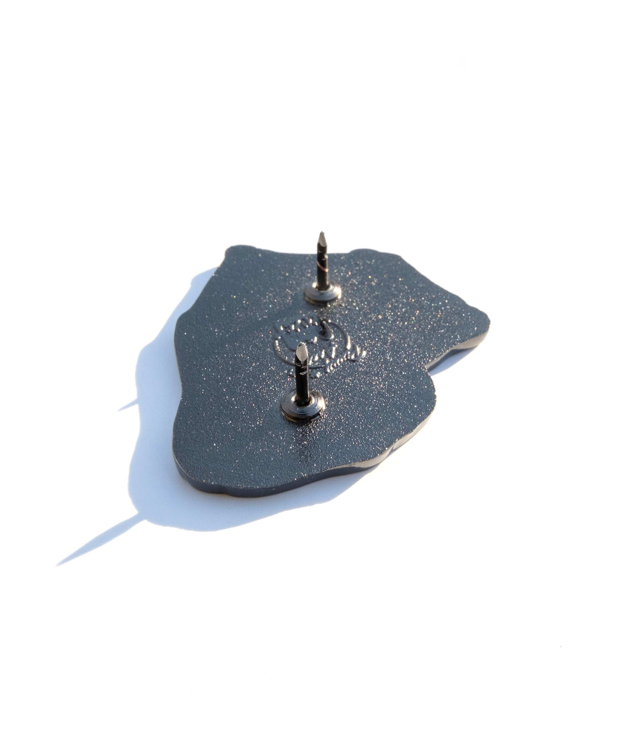 Photo of the back of the pin with a Pinny Arcade backstamp.