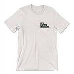 A t-shirt in natural white with a design printed on the front left chest. The design is the logo for Local News International. From Local News International.