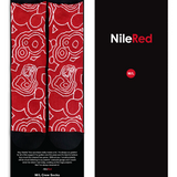 Red socks with the white line pattern and black accents on black sock packaging with NieRed branding on the front. Message from Nigel and the NileRed team on the inside of the packaging.