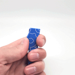 An animated photo gif of a hand opening and closing a blue bottle opener