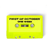 A digital mockup of a cassette tape. The cassette is bright yellow and reads "First of October: One Week" in black.