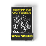 A digital mockup of a Cassette case. The case features a black and white collaged design of Rob Scallon and Andrew Huang playing various instruments and reads "First of October" with a paper strip around the bottom that reads "One Week." 