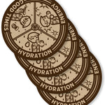 A digital mockup of a set of 4 coaters. They feature brown and tan illustrations of 3 different beverage enjoyment options, labeled Hydration, Energy, and Good Times.