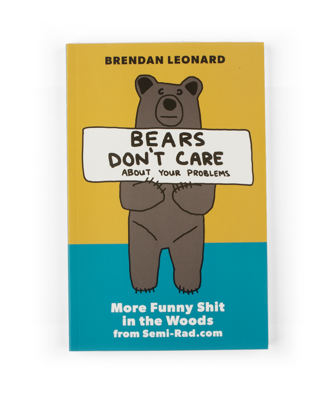The cover of a book with a yellow and blue background with an an illustration of a bear standing up holding a sign that says 