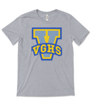 Heathered light grey short sleeve shirts with large V printed on them in yellow and blue. VGHS is written in block varsity letters across the bottom of the V.