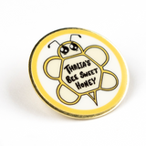 Gold pin with digitally printed geometric bee with large cute eyes and the words Thalia's Bee Sweet Honey on it