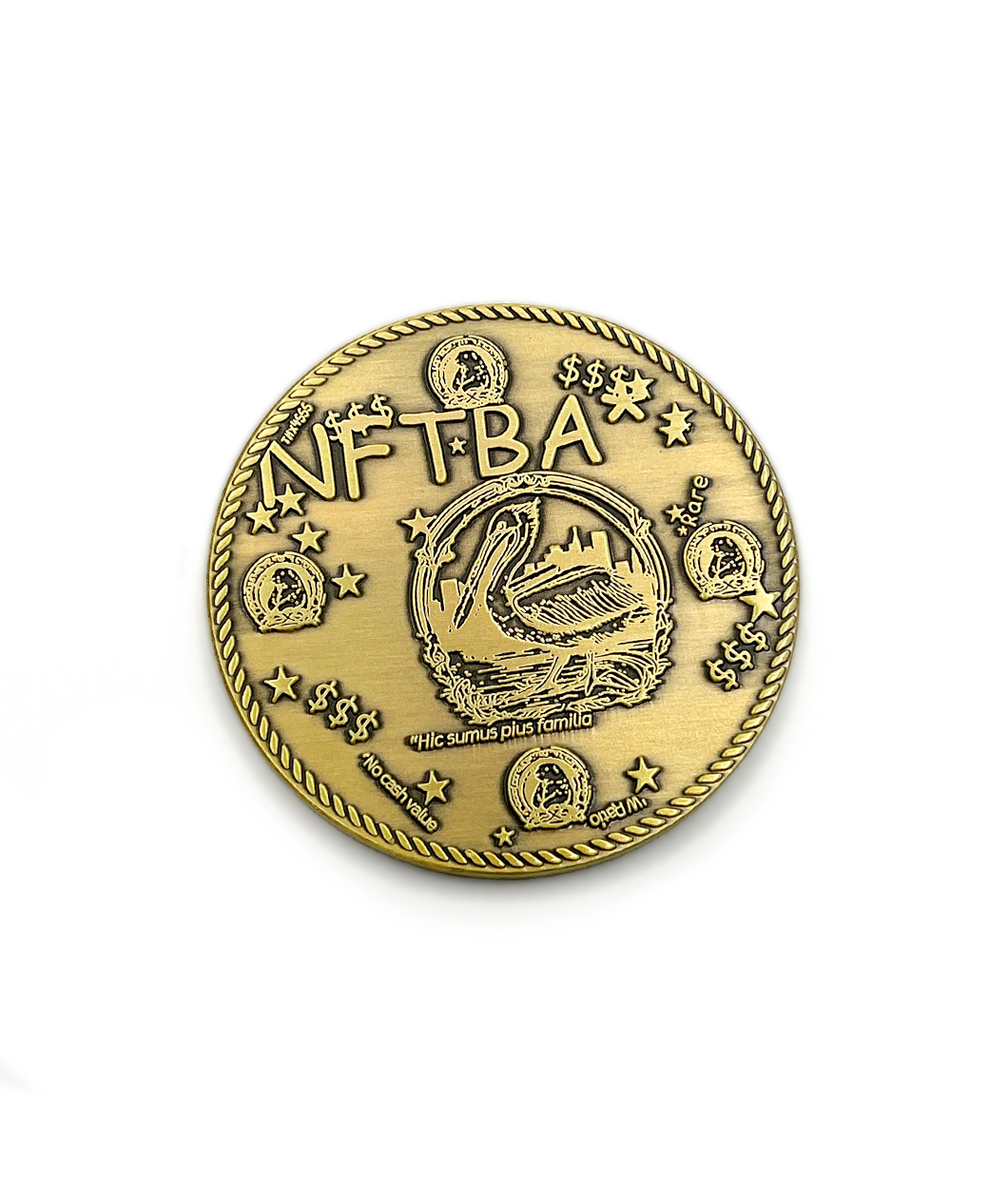 Front of antique gold coin with words NFTBA in comic sans font engraved into it. There is a clipart picture of a pelican with the phrase Hic sumus pius familia in the center-ish. There is a rope design border. There are smaller versions of the pelican image along the sides, stars, and dollar signs. There is a small phrase noting "No cash value" on the bottom.