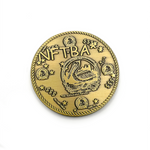 Front of antique gold coin with words NFTBA in comic sans font engraved into it. There is a clipart picture of a pelican with the phrase Hic sumus pius familia in the center-ish. There is a rope design border. There are smaller versions of the pelican image along the sides, stars, and dollar signs. There is a small phrase noting "No cash value" on the bottom.