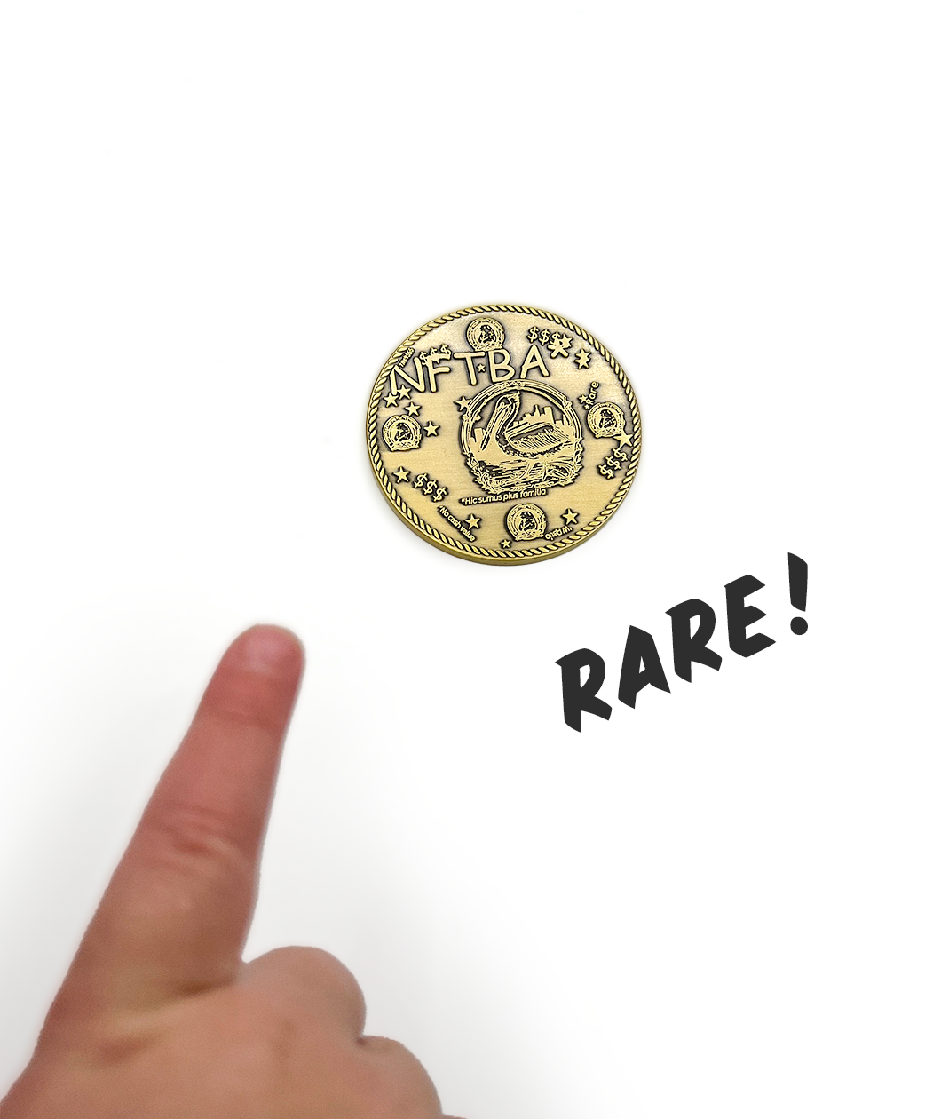 Finger pointing to antique gold coin with words NFTBA in comic sans font engraved into it. There is a clipart picture of a pelican with the phrase Hic sumus pius familia in the center-ish. There is a rope design border. Word RARE! is in this image to show the coin is rare to find.