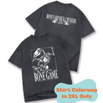 The front and back view of a faded black t-shirt. The design on the front of the shirt is an animal skeleton with limbs flailing about. The text around the skeleton reads, "Bone Game" and "We all have them, who needs them?" The back of the shirt is text that reads "Boneyard Dick Cruisers" and "Est. 2025, Drawfee." There is a label on the image that says this shirt colorway comes in 3XL only. From Drawfee.