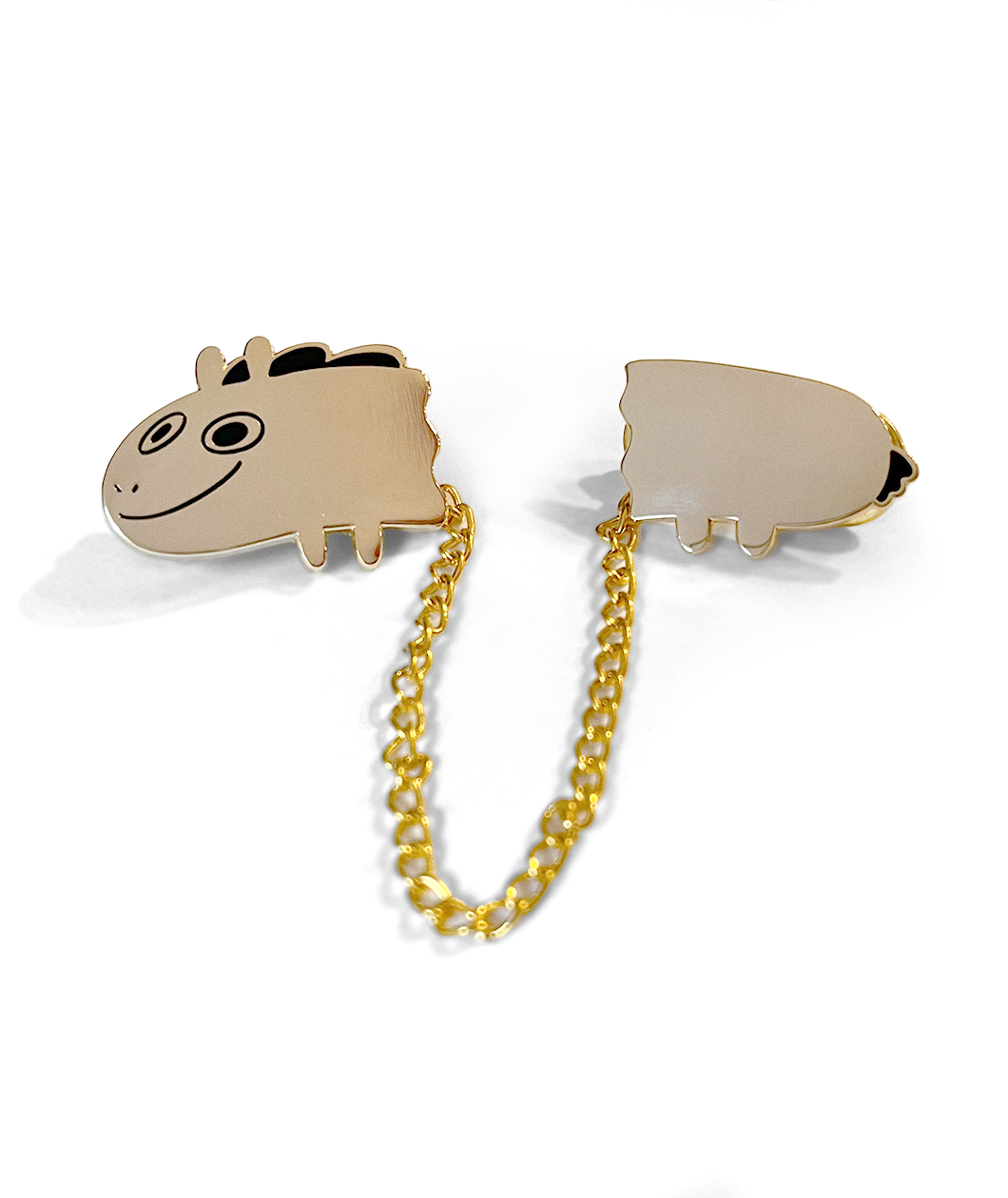 Two pieces of a golden pin that are attached by a gold chain. The front of the pin is the head of Jacob Horse and the other is the back half. From Drawfee. 