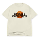 An off-white t-shirt with a printed design on the front. The design is of wavy black text over an illustration of an orange. The text reads, "lorem ipsum dolor sit, lauren epsum solo shit, dougus dippus deltoid dump, crampus krungus forrest gump". From Drawfee.