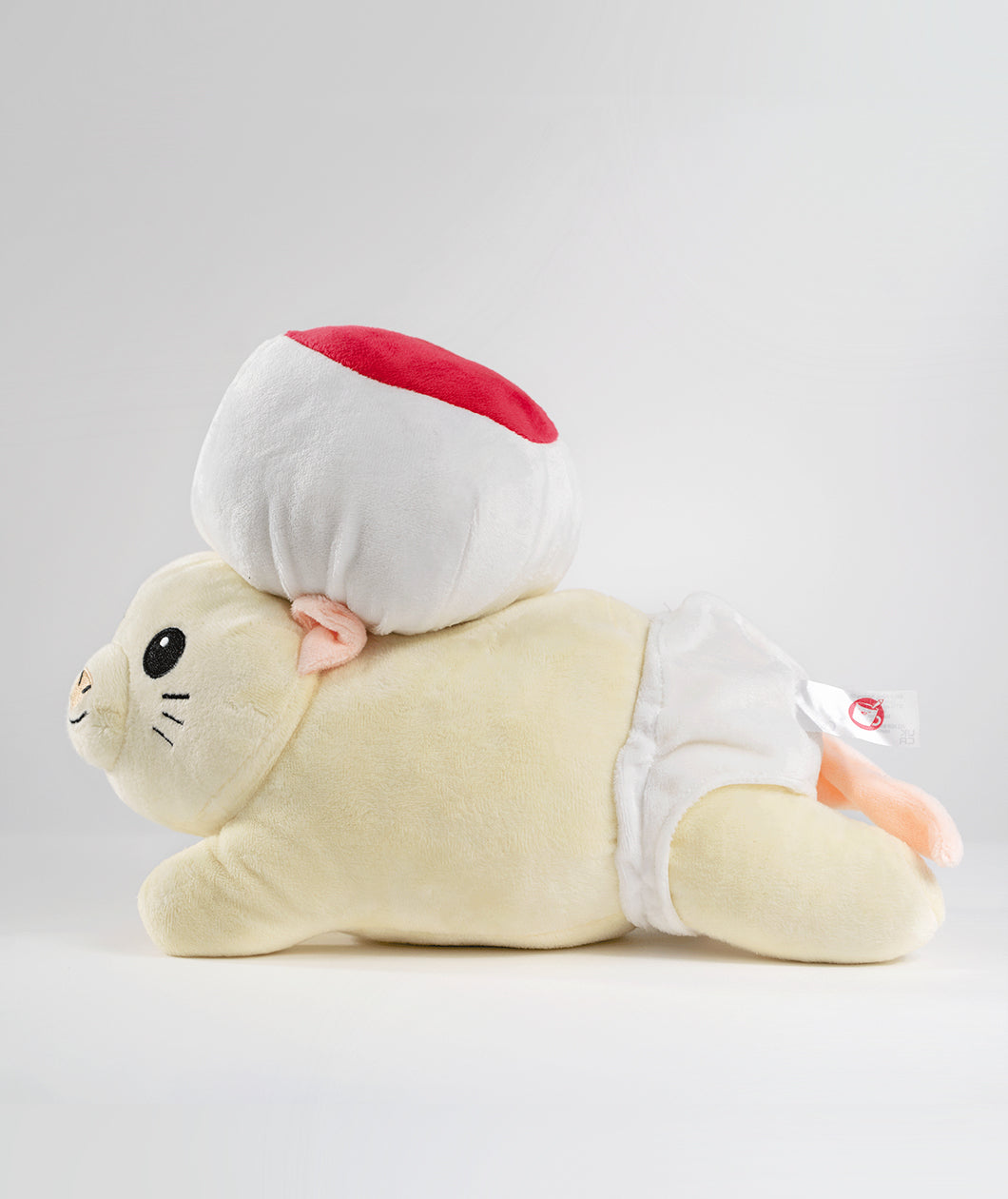 A side view photo of a mouse plushie with a round hat and a white diaper. The plushie is of Drawfee's character Todd. From Drawfee.