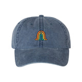 A blue pigment-dyed cap with the Rainbow Gubbins’ design on the front. From Gubbins.