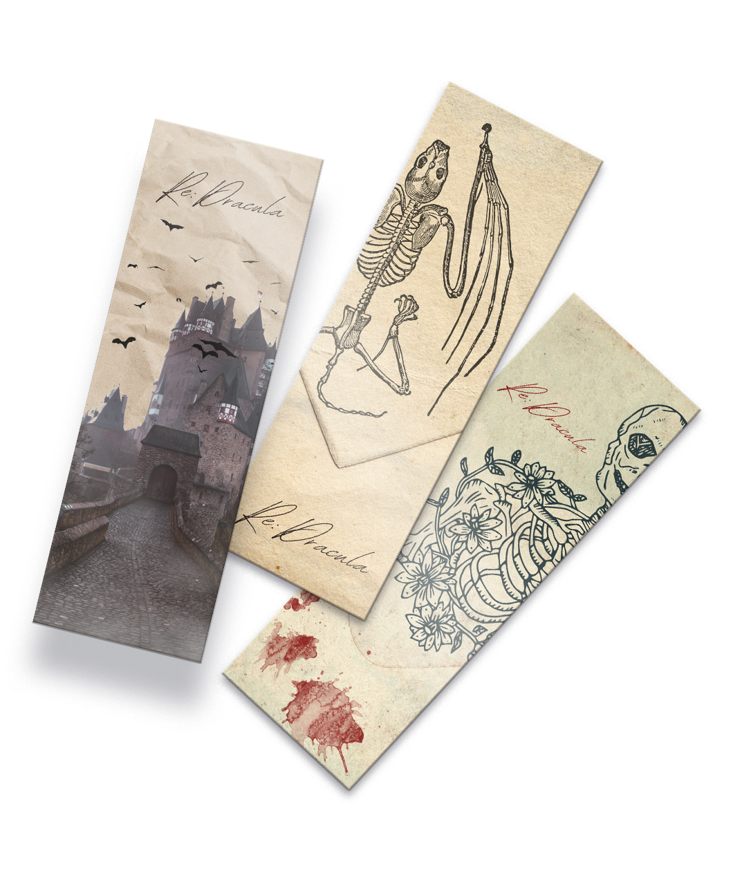 A set of three bookmarks with different illustrations, one of a spooky building with bats with text that reads 