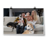 A photo of a couple, their baby, and their 3 dogs sitting on a couch - by Charles Trippy