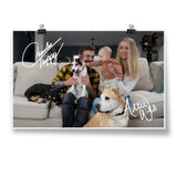 A signed photo of a couple, their baby, and their 3 dogs sitting on a couch - by Charles Trippy