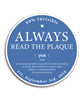 Blue and white circular sticker with phrase "Always read the plaque" above the definition of the word plaque  by 99% Invisible