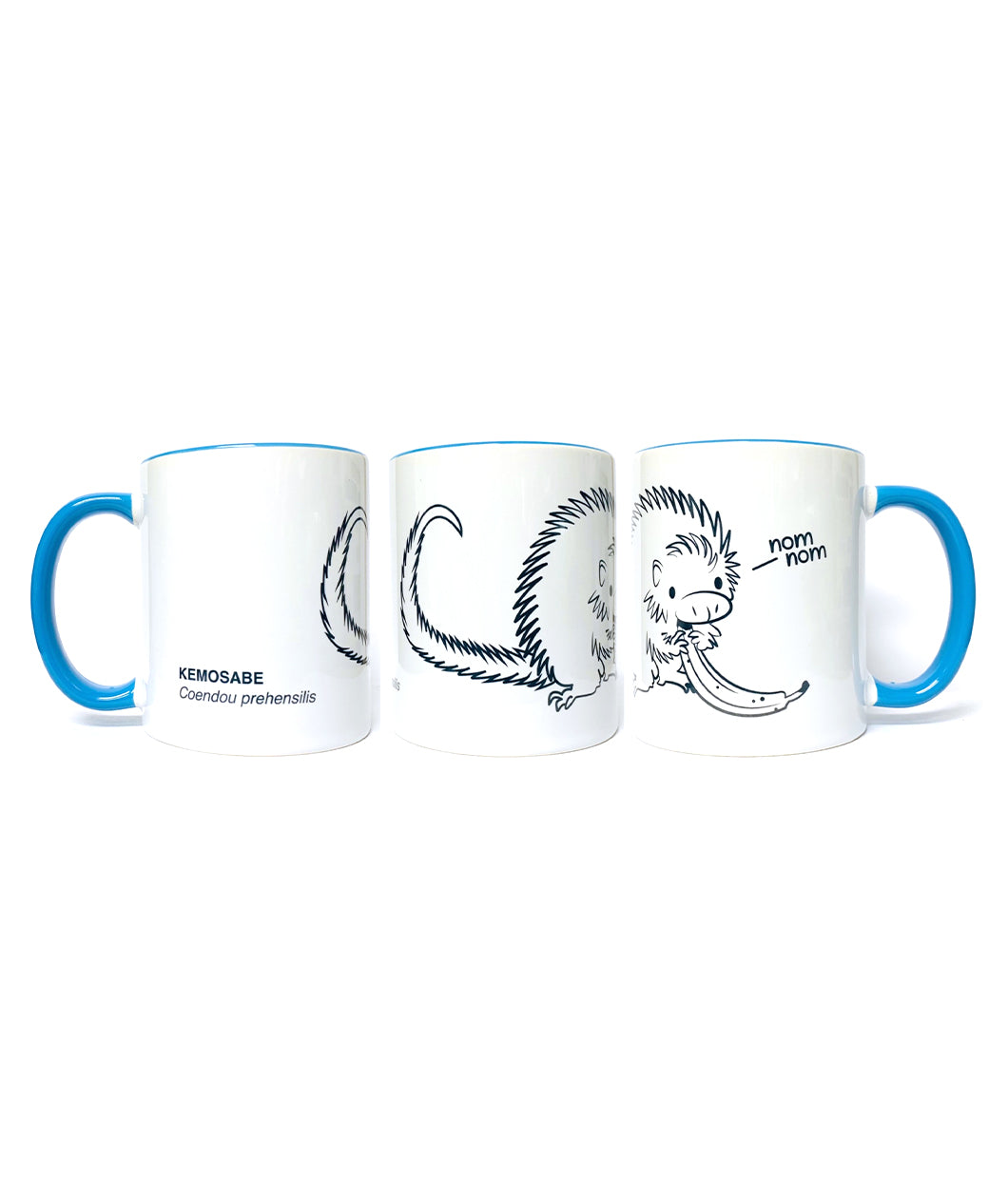 Three mugs in different positions to show design. Mug is white base with blue handle and blue inside. First: Black outline of tail of porcupine with writing on bottom left that says, “Kemosabe Coendou prehensilis” in black sans serif font. Second: Black outline drawing of porcupine with white filling eating a banana. Third: Black outline drawing of head and hands of porcupine eating a banana with, “nom nom,” in black sans serif font with a line near words coming from mouth - from Animal Wonders