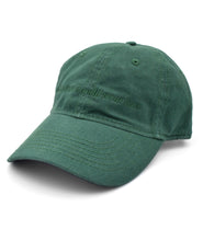 Side view of a green ball cap with lowercase embroidered words saying "i wish that i could wear hats". From Brian David Gilbert. 