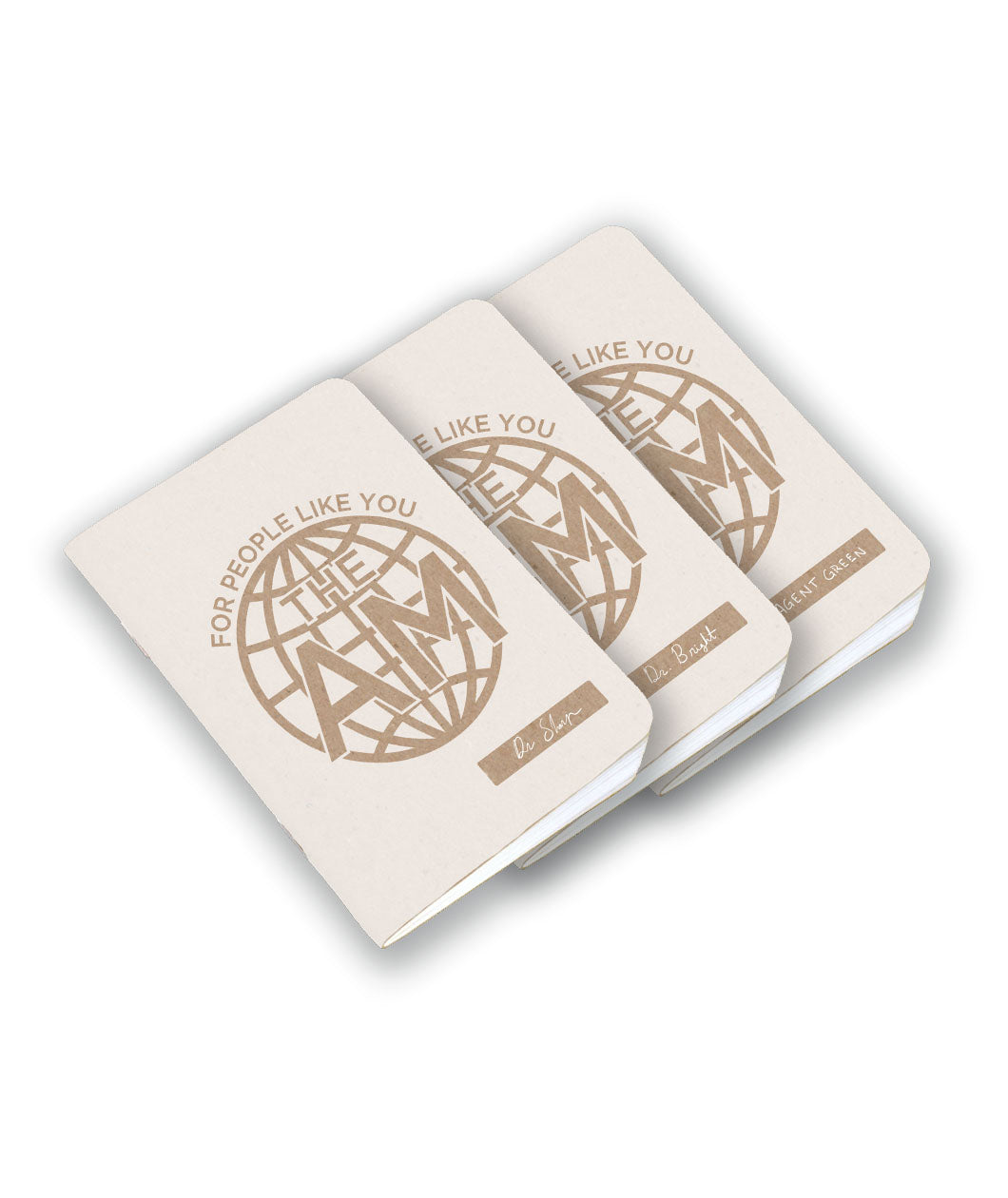 A set of three beige field notebooks with a circle in the middle and the text 
