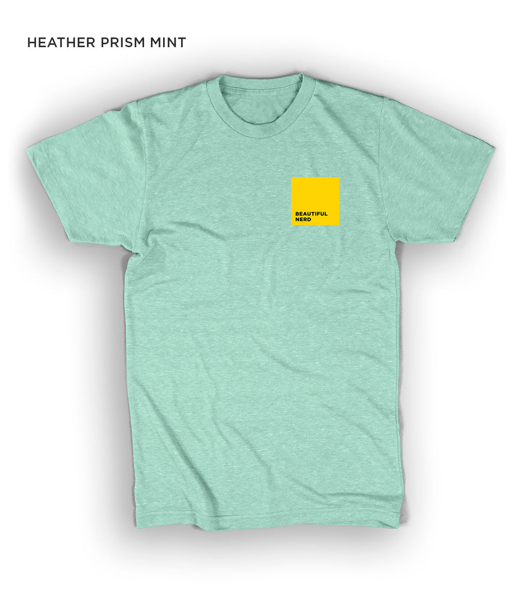 A mint short-sleeved t-shirt with a yellow square on the upper right side of the chest - by 99% Invisible