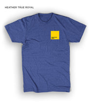 A royal blue short-sleeved t-shirt with a yellow square on the upper right side of the chest - by 99% Invisible