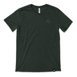 A dark green t-shirt with a small, subtle beaker logo from CGP Grey in the top left area of the shirt. 