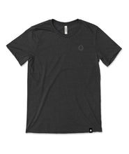 A dark grey t-shirt with a small, subtle beaker logo from CGP Grey in the top left area of the shirt. 