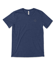 A dark blue t-shirt with a small, subtle beaker logo from CGP Grey in the top left area of the shirt. 