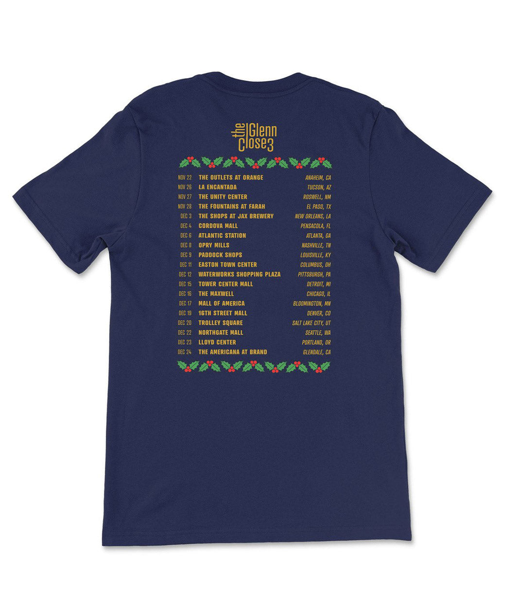 Back of navy blue t-shirt with yellow text of tour dates and locations with green and red screen printed holly and berries.