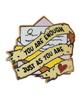 Gold plated hard enamel pin with an illustration of a torn yellow ribbon that says, "YOU ARE ENOUGH JUST AS YOU ARE" and there is an open letter in the background of the pin as well.