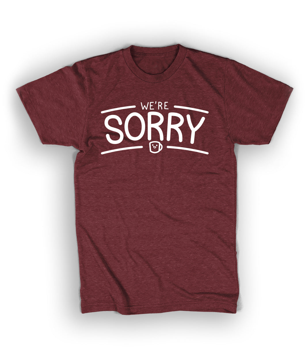 A red t-shirt the the words "We're" above the larger word "Sorry". A small Drawfee logo mug is below the word "Sorry". 