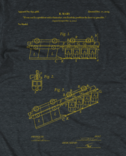 Close-up of a funicular blueprint in yellow on a gray shirt - by 99% Invisible