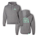 A gray hoodie with a green outline triangle surrounding a green tree. On the left side of the tree is a “G” and on the right is “R” both in white. On the back is a green outline vector drawing of a sun rising above a mountain with a half circle around both. “G” and “R” are in white on either side of a green tree - from the Ginger Runner