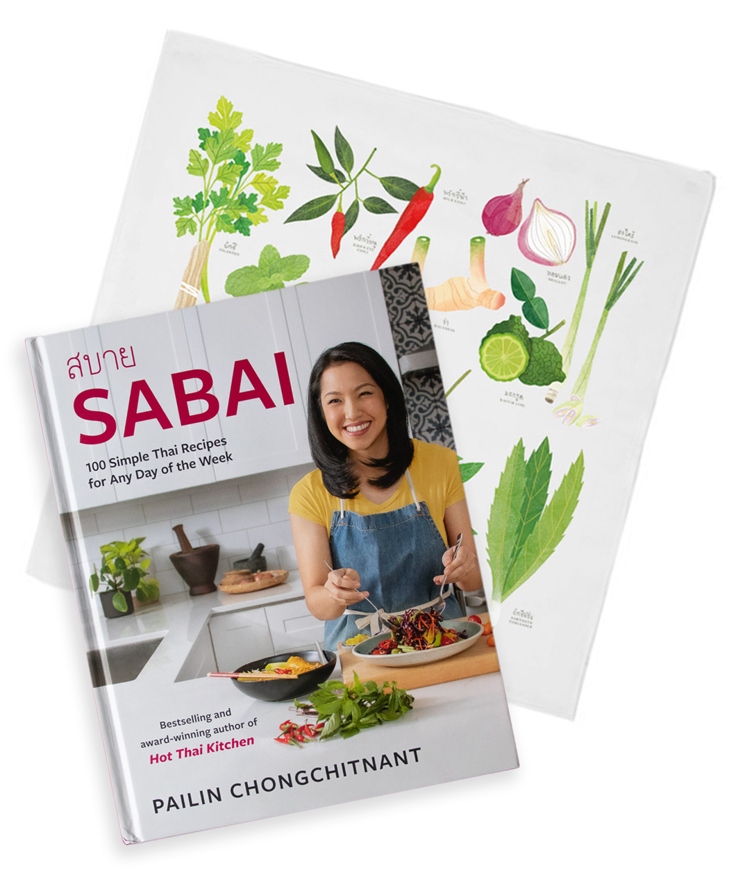 A cookbook title "Sabai" by Pailin Chongchitnant from Hot Thai Kitchen. The cover is Pailin in a kitchen tossing a meal on a plate. Behind the book is a tea towel with colorful illustrations of Thai herbs. 
