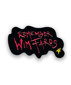 A black pin that is blob shaped with the words "Remember Wim Faros" written in red and a small yellow star. From It Makes a Sound.