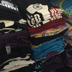 3 stacks of t-shirts - by Charles Trippy