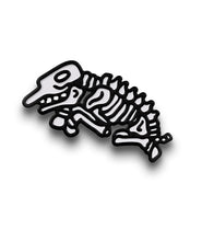 A pin of a black and white zebra skeleton. 