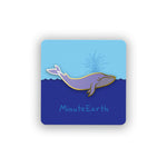 A pin shaped like a blue whale on a card backing showing ocean and sky with the text "MinuteEarth".