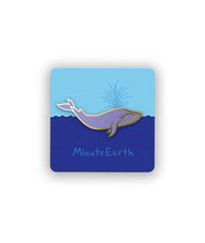 A pin shaped like a blue whale on a card backing showing ocean and sky with the text "MinuteEarth".