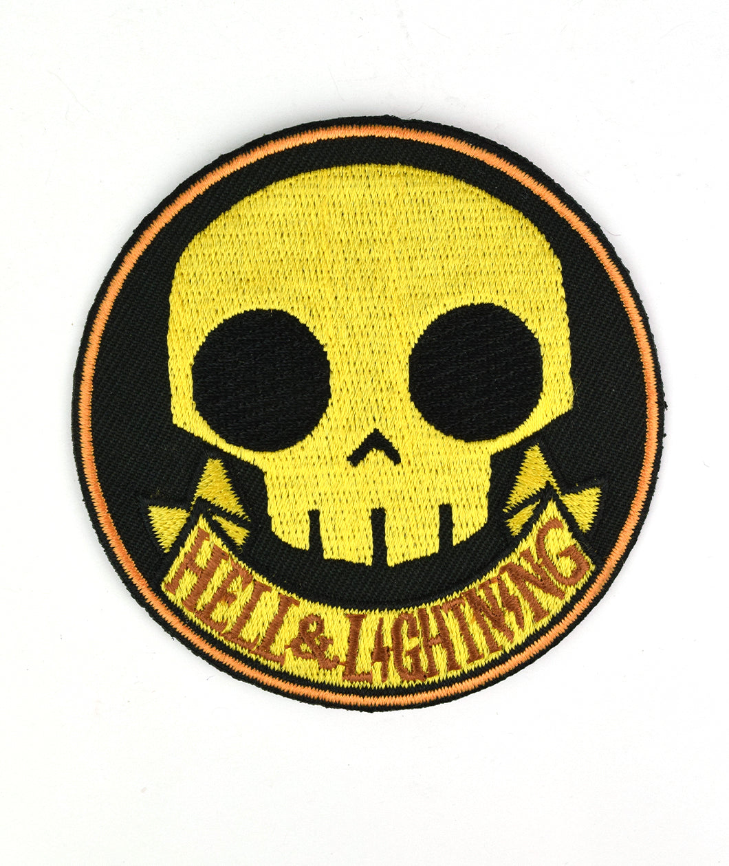Black circle patch with a thin orange outline. Yellow vector skull is in the center. Below the skull is a banner with “Hell & Lightning” in orange serif font - from Tesladyne