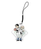 A charm on a black string with a loop. Two people in baseball outfits stand back to back holding a ball and a mitt. From Jenn Doyle. 
