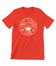 The front of an orange t-shirt with a circle in the center with the text "Free T-Shirt Club" inside as well as two hand-drawn stars and a small face in flames in the very center of the circle. From PlayFrame.