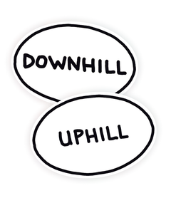 Two oval, white stickers with a black outline that read "Downhill" and "Uphill". From Semi Rad. 