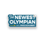 Blue base sticker, the right side is squared off, the left is bubbled around the text. “The Newest Olympian” is written in white sans serif font. “With Mike Schubert” is in white sans serif font below. A yellow trident is to the left of text - from The Newest Olympian