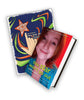 This Star Won’t Go Out book in front of coloring book. Book has a picture of smiling Esther Earl wearing blue floral design shirt with red background. Title is written in lime green sans serif font.  Coloring book has blue background with green and orange swooping shapes throughout the cover. Hand has finger holding orange star with white geometric shapes on each arm of star. Title is written in white sans serif font.  - from This Star Won’t Go Out
